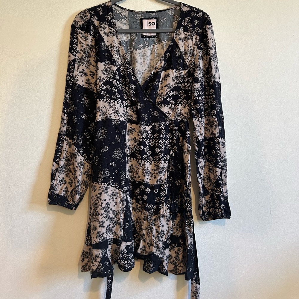 Patterned mini dress with clip in front.